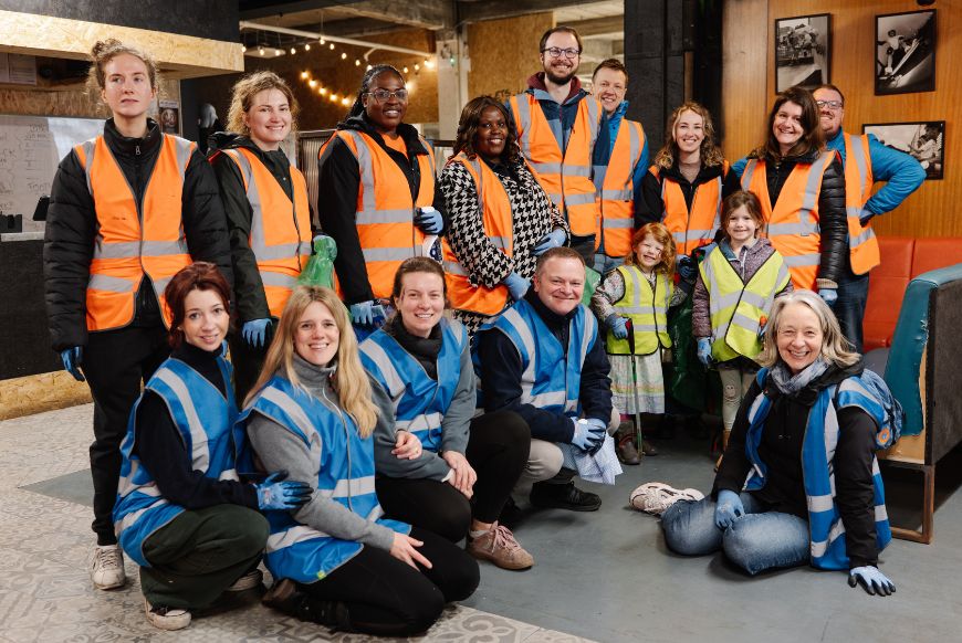 people in high vis posing for picture